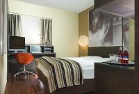 Nowocześnie wyposażona sypialnia w Hotelu Soho, w centrum miasta